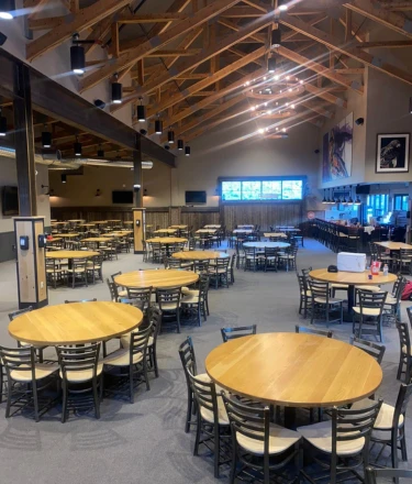 Large commercial function room with high ceilings. 